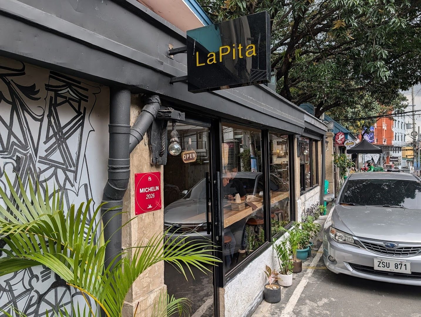 LaPita restaurant exterior on Don Pedro Street, Poblacion with Michelin plaque