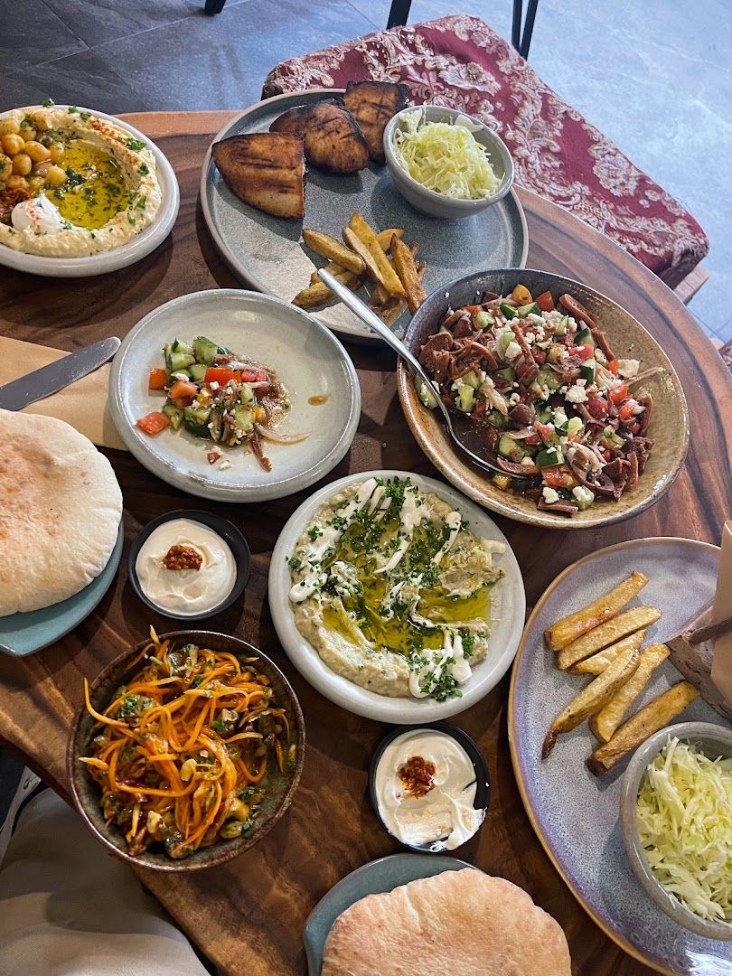 A full Mediterranean spread featuring multiple dishes